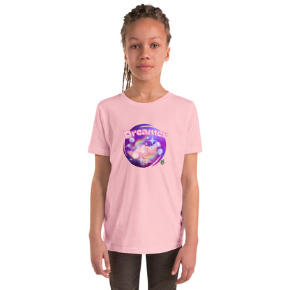 A girl standing wearing a pink kids graphic t-shirt with the word Dreamer on a galaxy background, by Wizard Prints