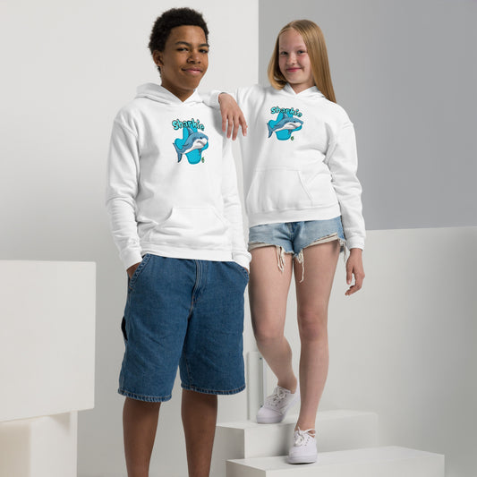 A boy and girl wearing a Wizard Prints kids hoodie in white with a printed graphic on the front of a cartoon shark with the words, Sharkie