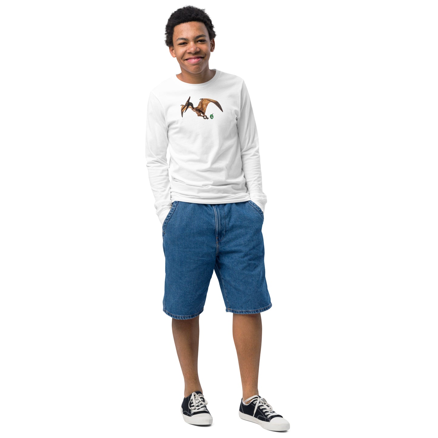 A boy standing and wearing a white long-sleeve T-shirt featuring a printed graphic of a Pterodactyl, by Wizard Prints.