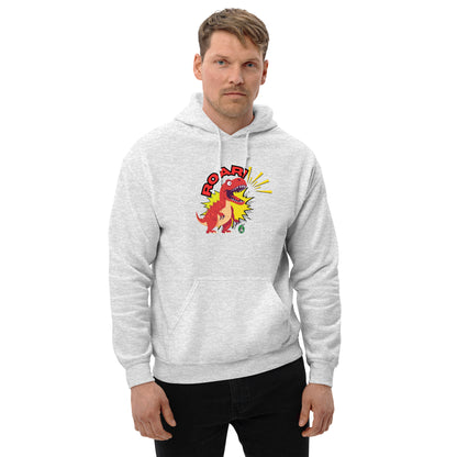 A man standing wearing an ash hoodie with a printed graphic of a red roaring cartoon dinosaur and the word Roar! Designed by Wizard Prints