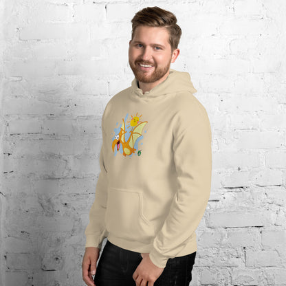 A man standing wearing a beige hoodie with a printed graphic of a smiling cartoon dinosaur and the sun. Designed by Wizard Prints.