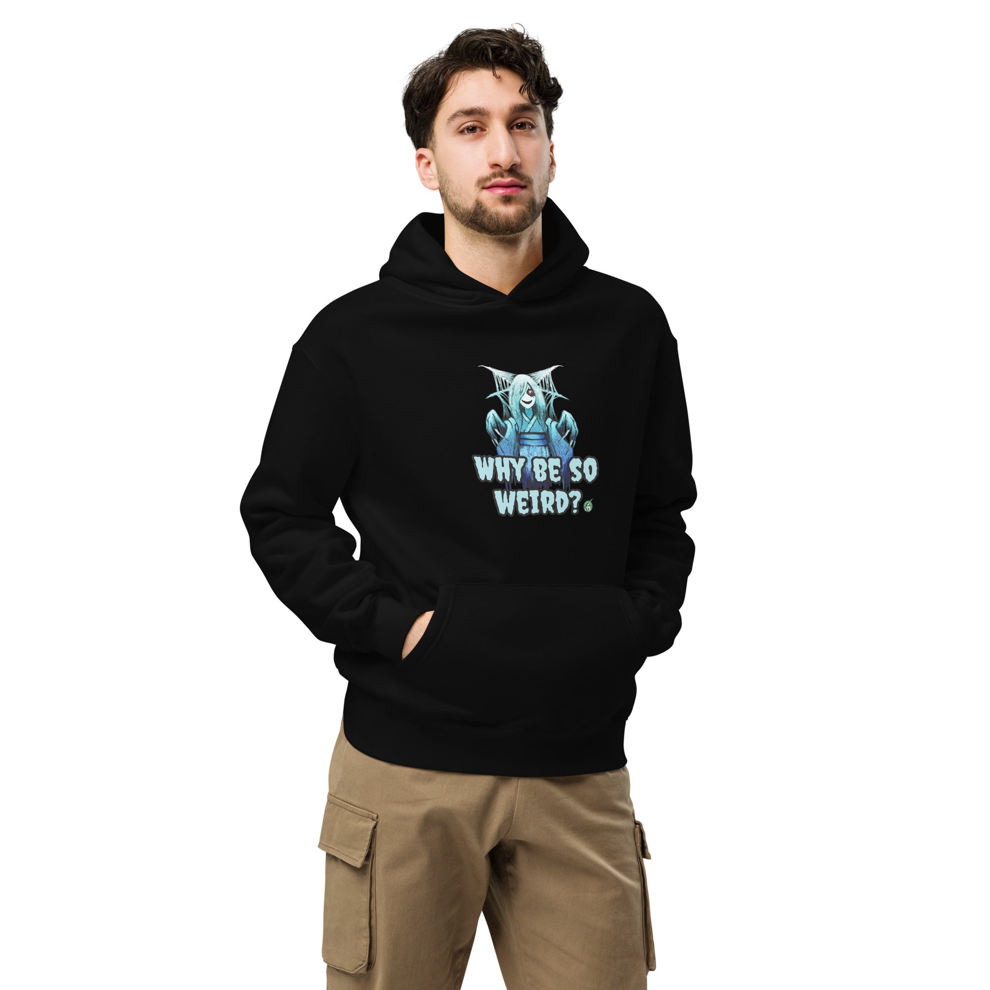 A man standing wearing a black hoodie by Wizard Prints featuring a printed graphic of a blue ghost girl with the words, Why Be So Weird?.