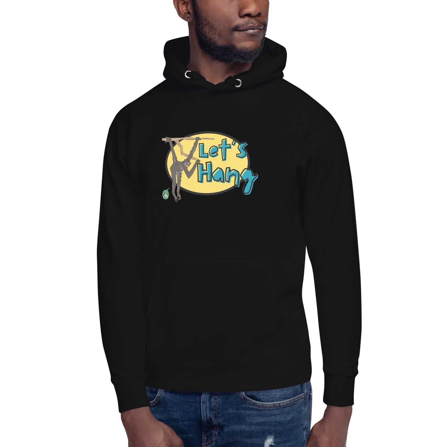 A man standing wearing black hoodie with a printed graphic of a monkey hanging on a branch with the words, Let's Hang. Designed by Wizard Prints.