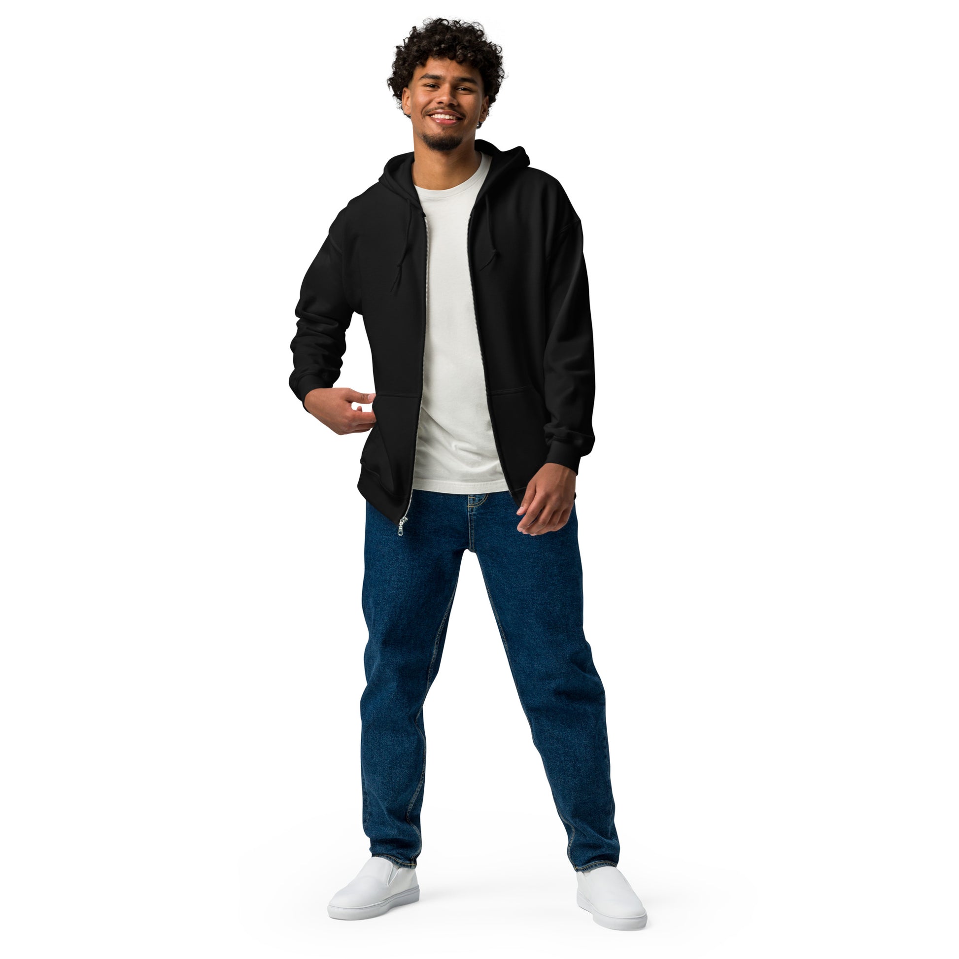 A man standing wearing a black zip through hoodie by Wizard Prints Shop and jeans