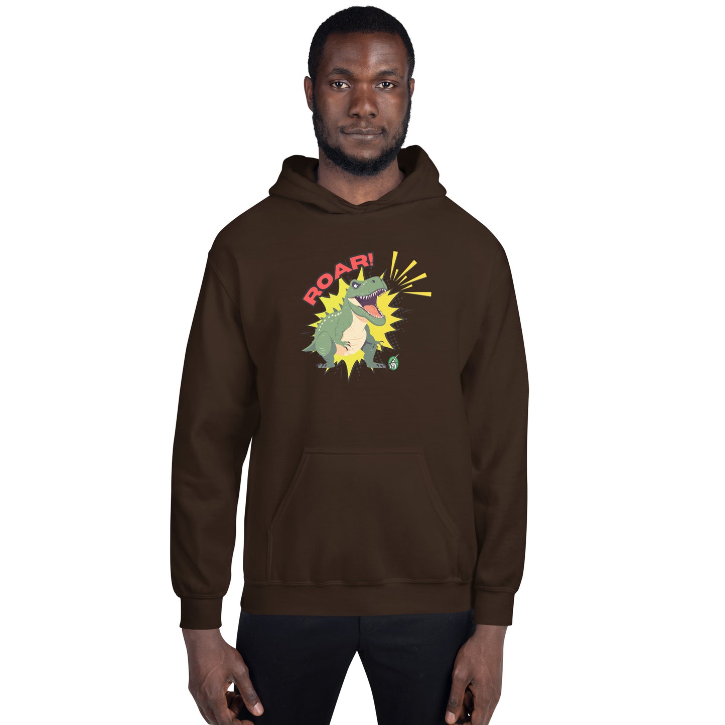 A man standing wearing a brown hoodie with a printed graphic of a green roaring cartoon dinosaur and the word Roar! Designed by Wizard Prints