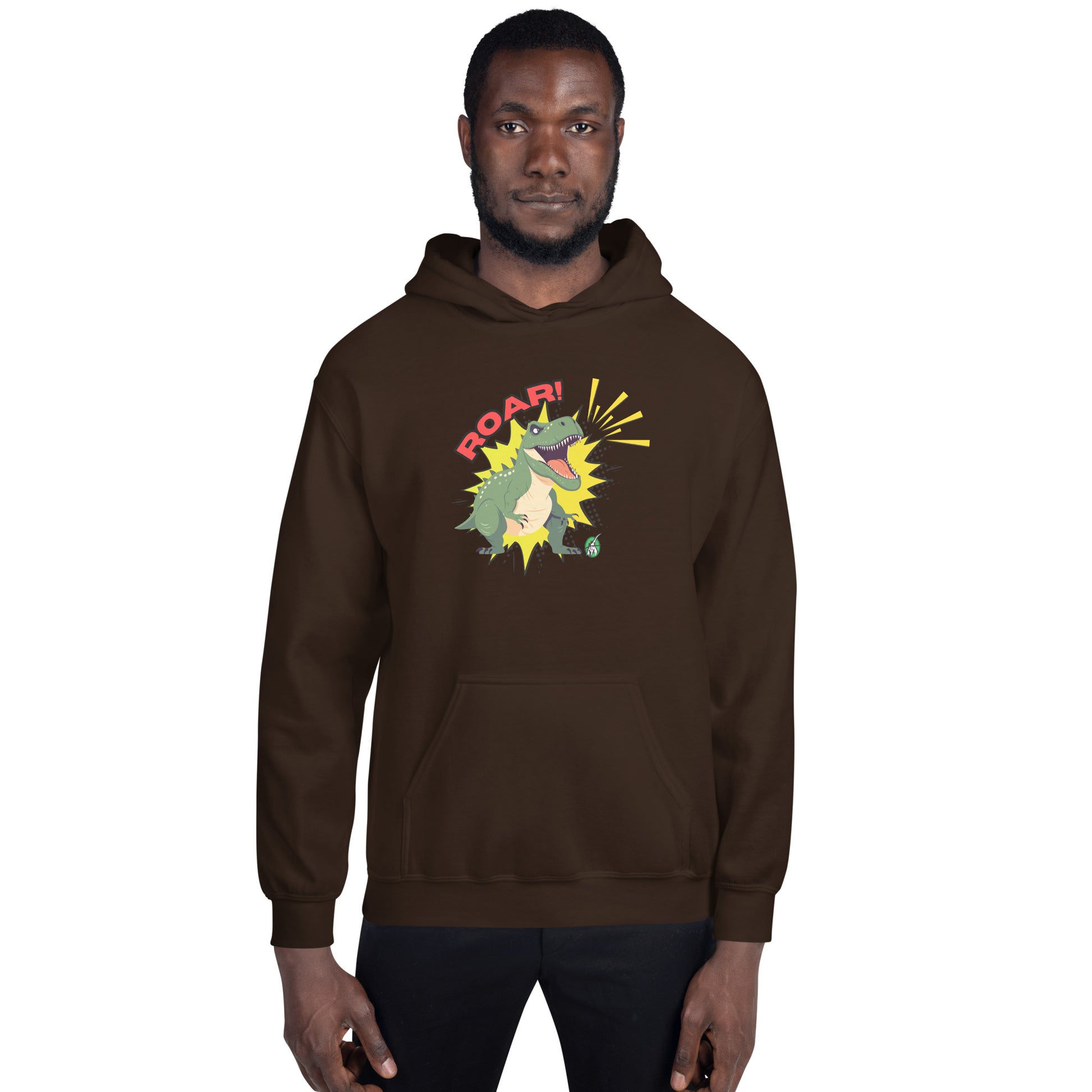 A man standing wearing a brown hoodie with a printed graphic of a green roaring cartoon dinosaur and the word Roar! Designed by Wizard Prints