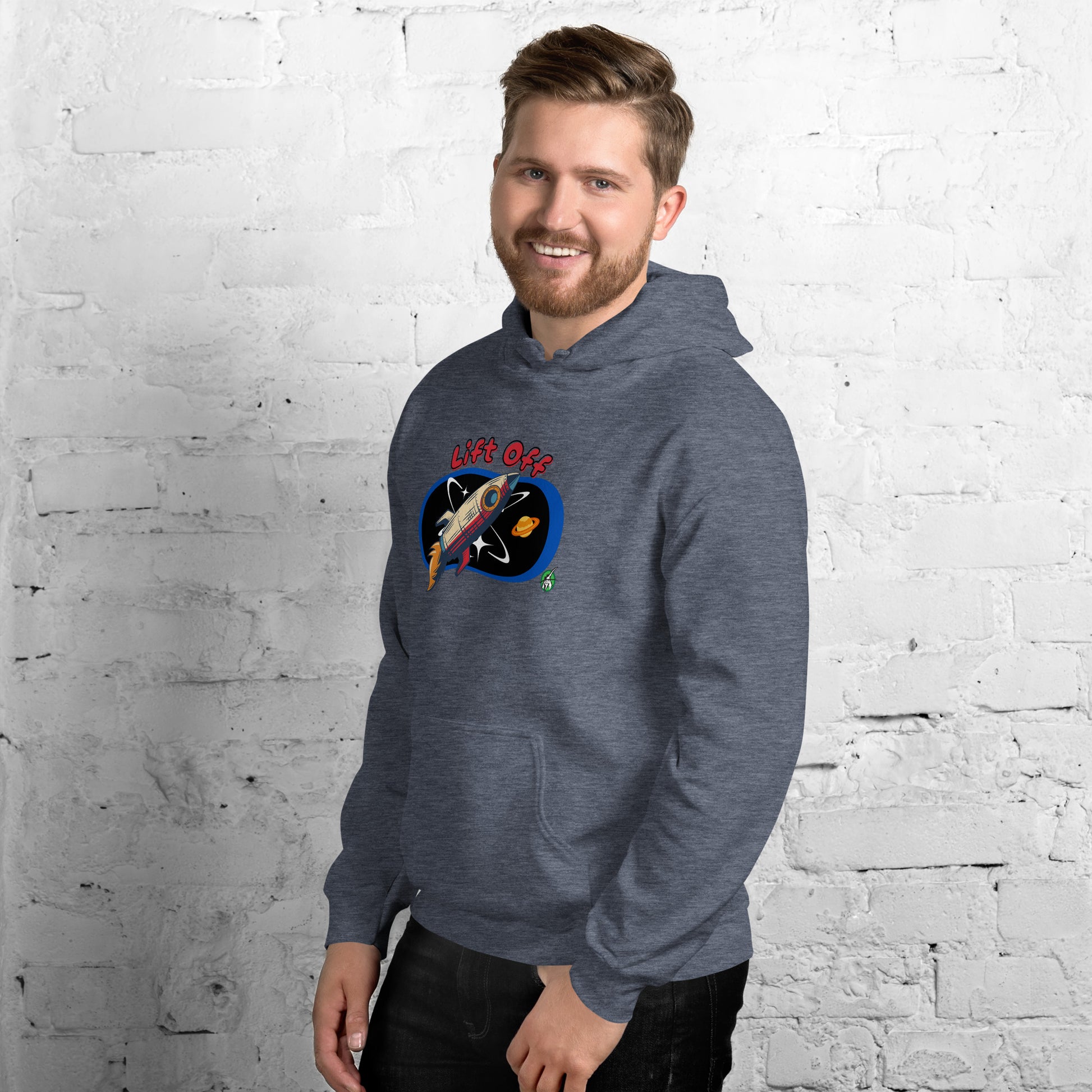 A man standing wearing a dark grey hoodie with a printed graphic of a rocket and the words, Lift Off. Designed by Wizard Prints.