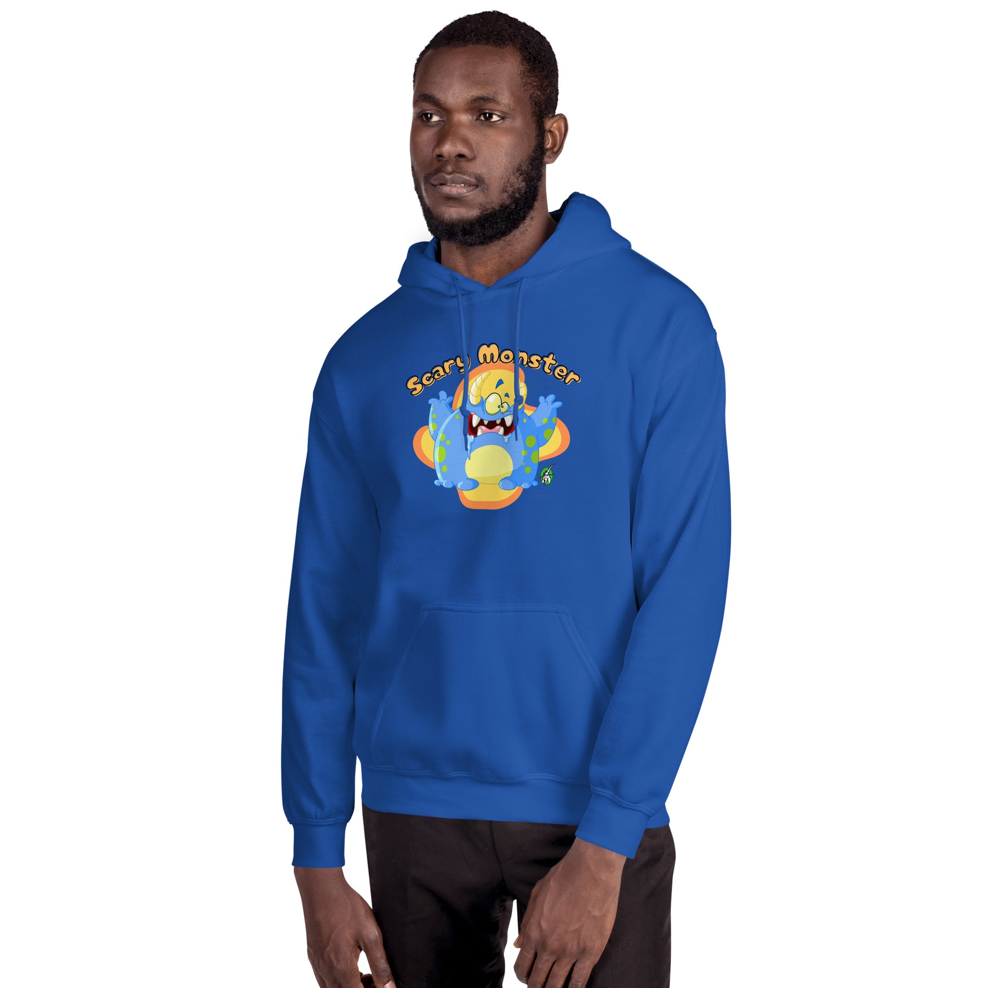A man standing wearing a blue hoodie with a printed graphic of a cartoon monster and the words, Scary Monster. Designed by Wizard Prints.