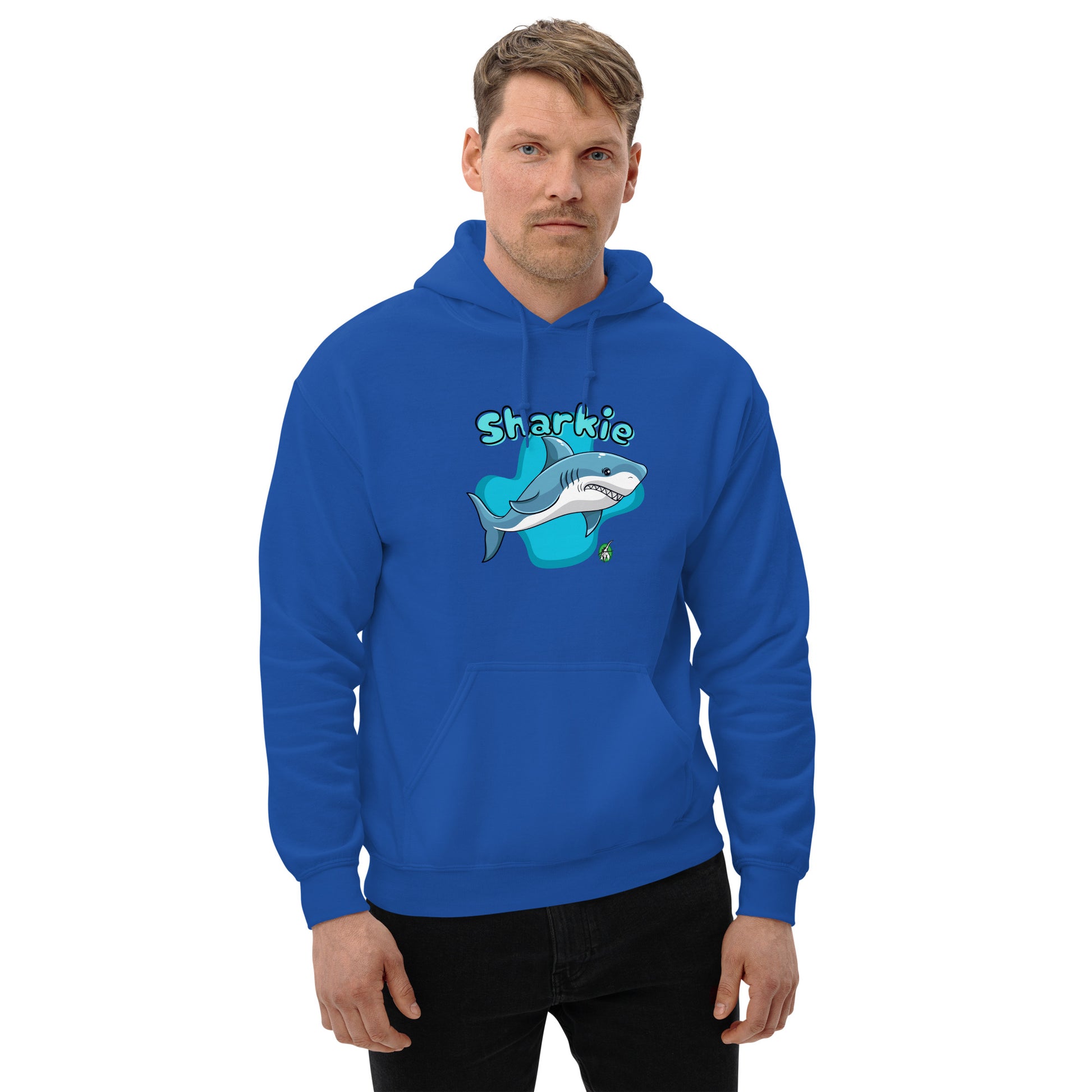 A man standing wearing a blue hoodie with a printed graphic of a cartoon shark and the word, Sharkie. Designed by Wizard Prints.
