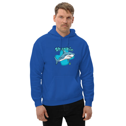 A man standing wearing a blue hoodie with a printed graphic of a cartoon shark and the word, Sharkie. Designed by Wizard Prints.