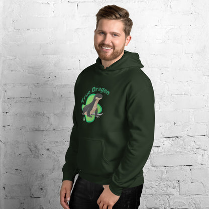 A man standing wearing a forest green hoodie with a printed graphic of a komodo dragon and the words, True Dragon. Designed by Wizard Prints.