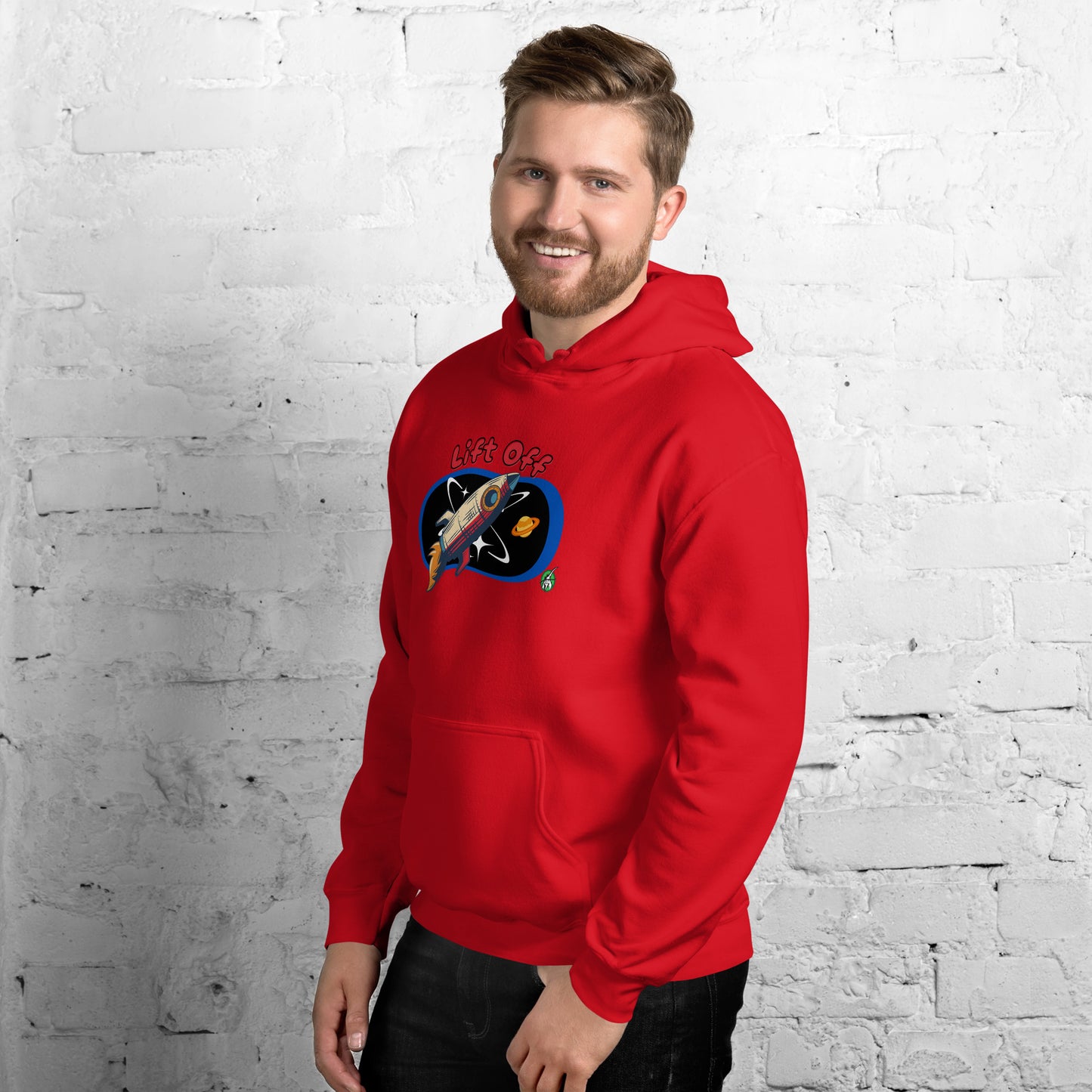 A man standing wearing a red hoodie with a printed graphic of a rocket and the words, Lift Off. Designed by Wizard Prints.