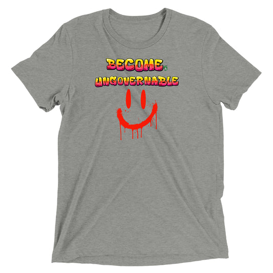 A Wizard Prints men's graphic rebel t-shirt in grey with a printed graphic on the front of Ungovernable with weird smiley face graphitti style 