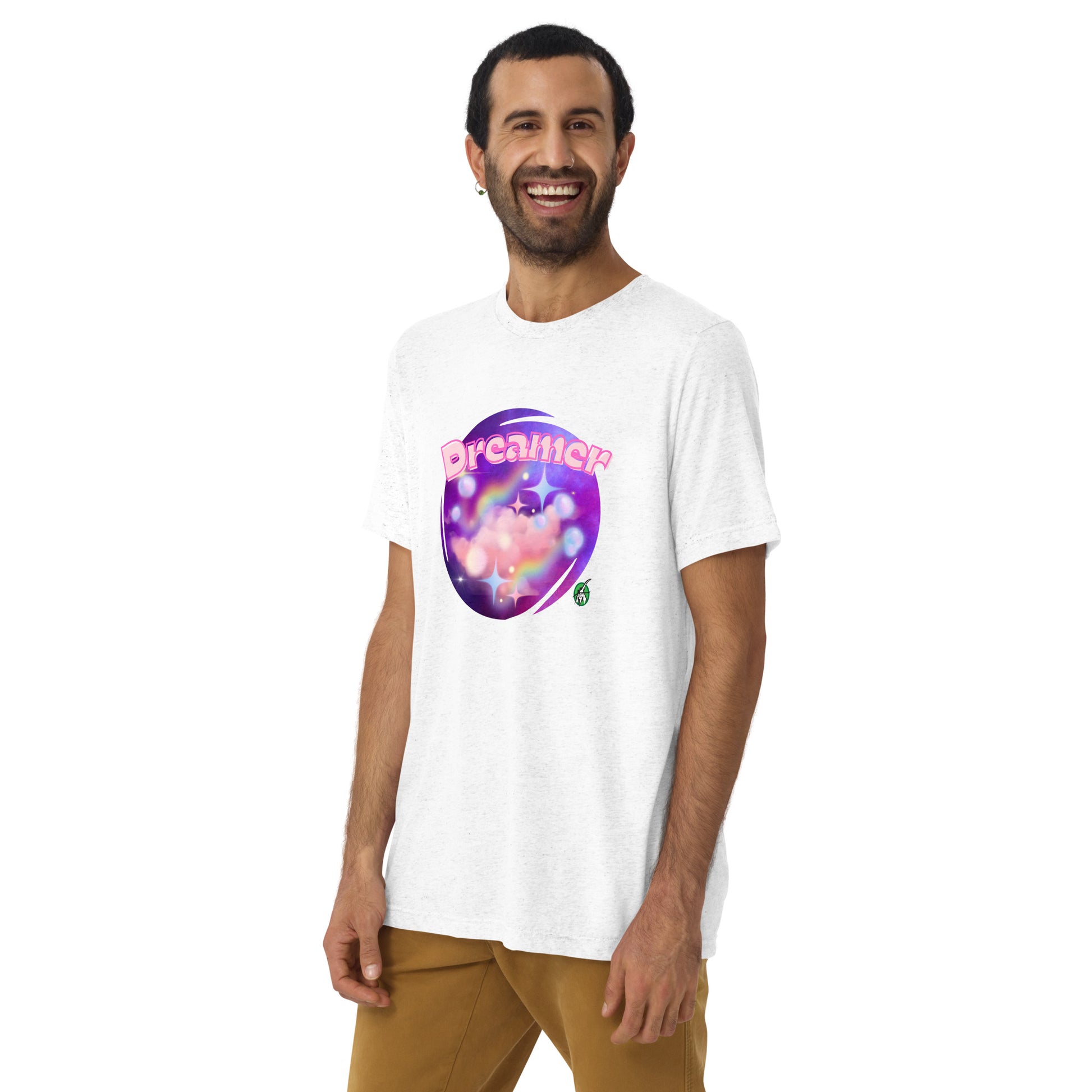 A man standing wearing a white tee shirt with a printed graphic of a galaxy background and the word Dreamer on top. Designed by Wizard Prints