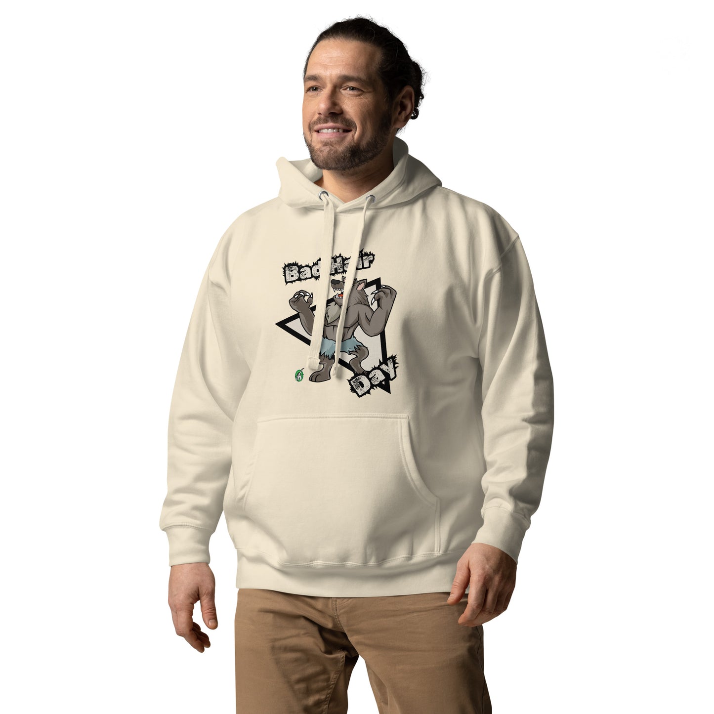 A man standing and wearing a beige hoodie with a printed graphic of a werewolf with the words, Bad Hair Day. Designed by Wizard Prints.
