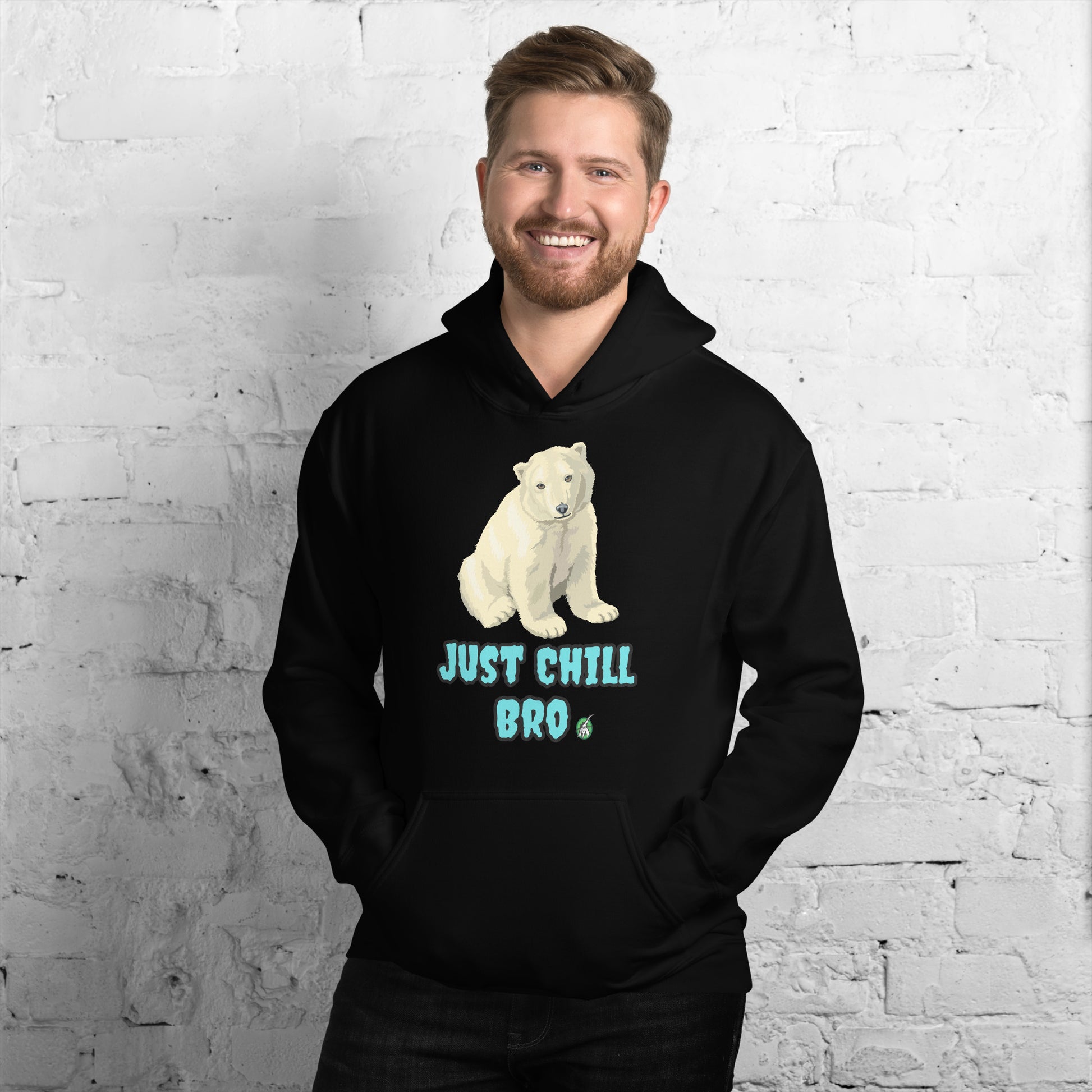 A man standing wearing a black hoodie with a printed graphic of a bear with the words, 'Just Chill Bro'. Designed by Wizard Prints.