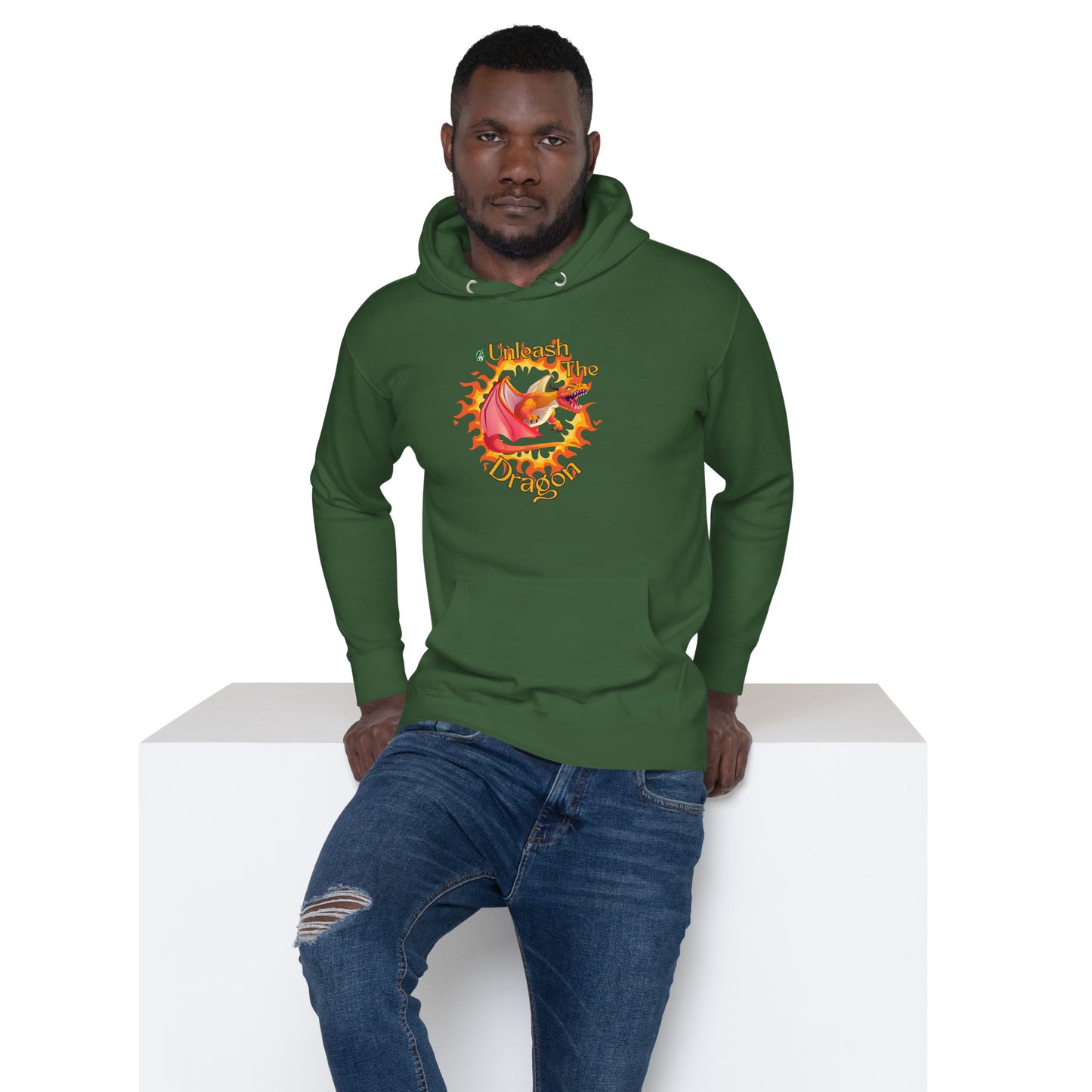 A man standing wearing a forest green hoodie with a printed graphic of a fire-breathing dragon with the words, 'Unleash the Dragon'. Designed by Wizard Prints.