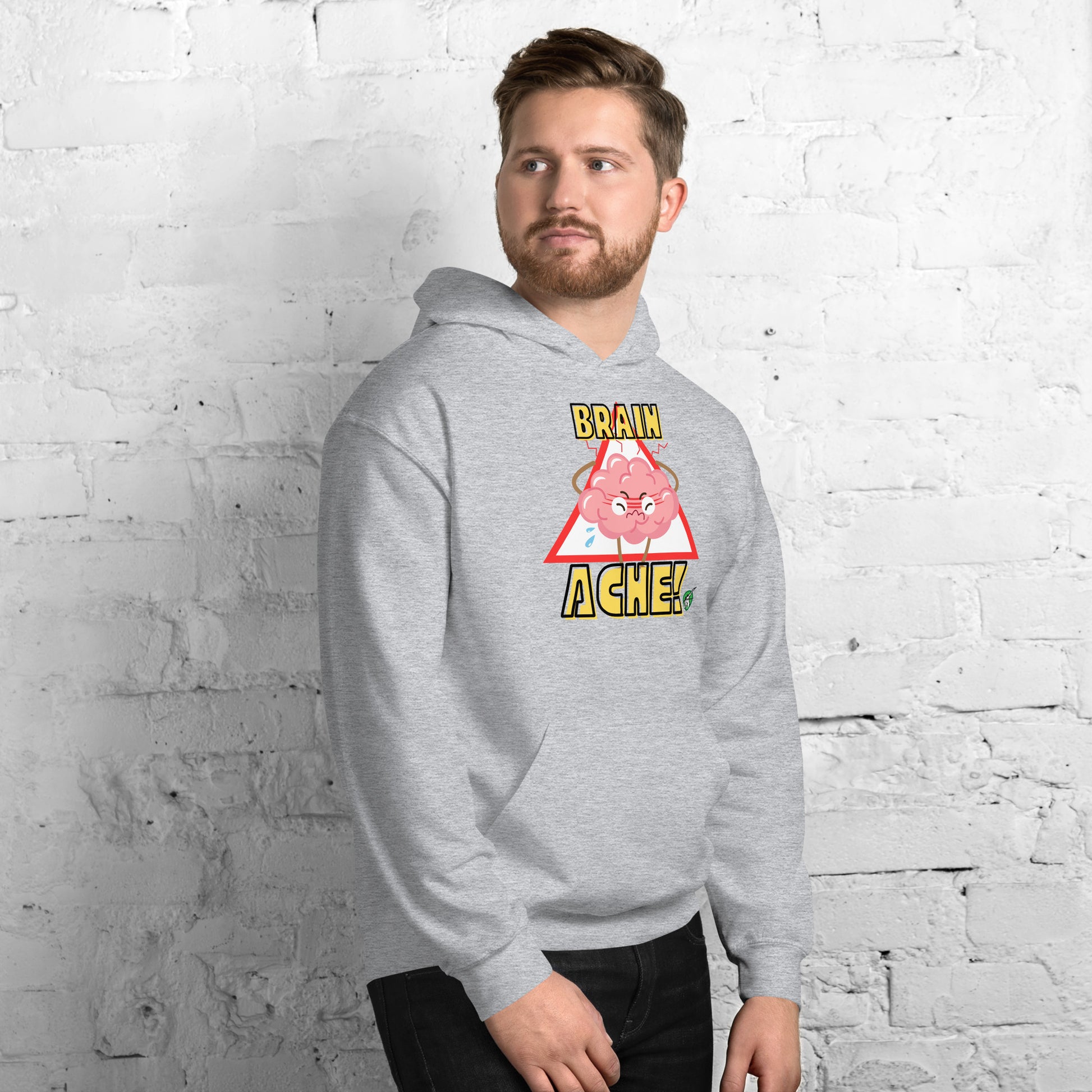 A man standing wearing a grey hoodie with a printed graphic of a brain with the words, Brain Ache. Designed by Wizard Prints.