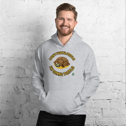 A man standing wearing a grey hoodie with a printed graphic of a turtle with the words, I Don't Wanna People I'm Gonna Turtle. Designed by Wizard Prints.