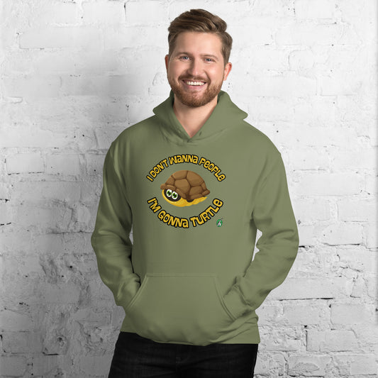 A man standing wearing a military green hoodie with a printed graphic of a turtle with the words, I Don't Wanna People I'm Gonna Turtle. Designed by Wizard Prints.