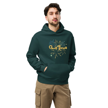 A man standing wearing a pine green hoodie by Wizard Prints featuring a printed graphic of fireworks with the words, 'Good Times'.