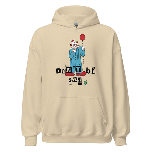 Men's sand beige hoodie with a printed graphic of a clown holding a balloon with the words, 'Don't Be Sad'. Designed by Wizard Prints.
