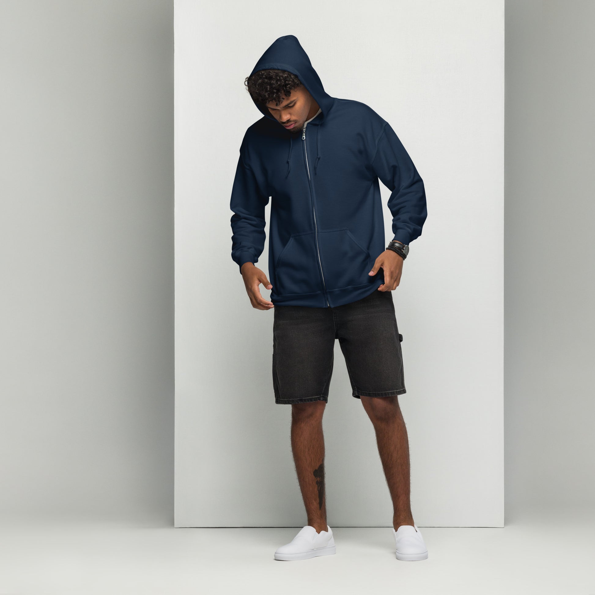 A man standing wearing men's navy zip through hoodie by Wizard Prints Shop