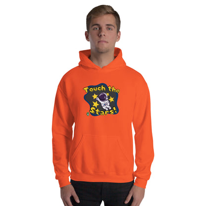 A man standing wearing an orange hoodie with a printed graphic of a cartoon astronaut and the words, Touch the Stars. Designed by Wizard Prints.