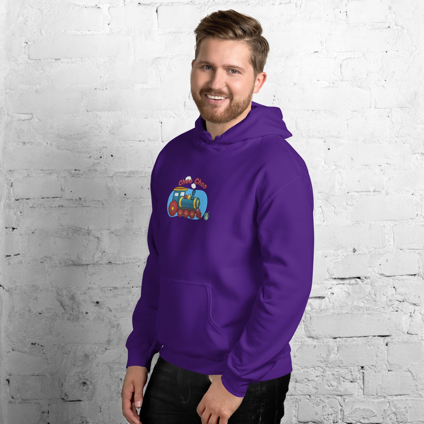 A man standing wearing a purple hoodie with a printed graphic of a cartoon train and the words 'Choo Choo'. Designed by Wizard Prints