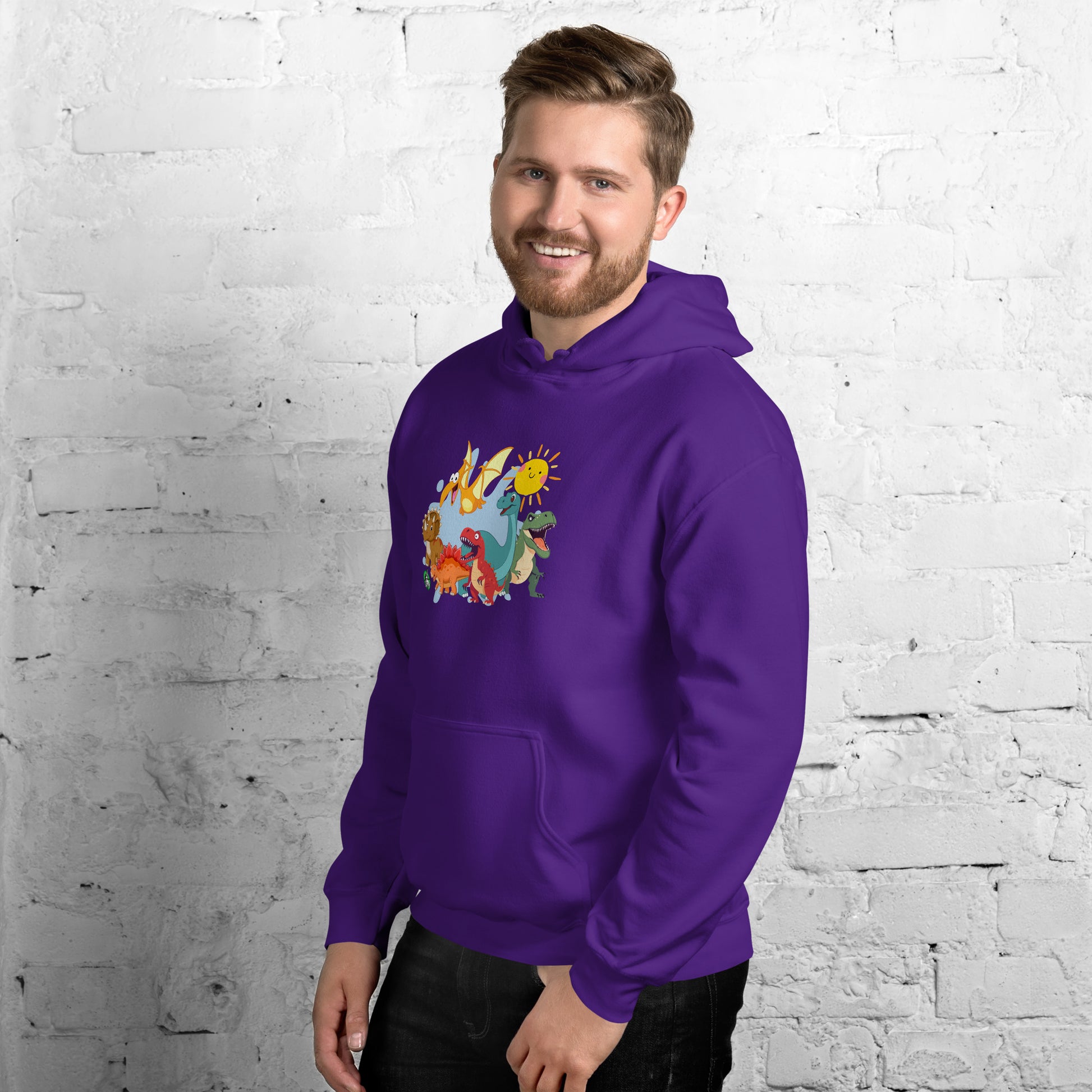 A man standing wearing a purple hoodie with a printed graphic of different colorful dinosaur types and the sun. Designed by Wizard Prints.