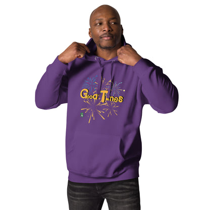 A man standing wearing a purple hoodie with a printed graphic of fireworks with the words, 'Good Times'. Designed by Wizard Prints