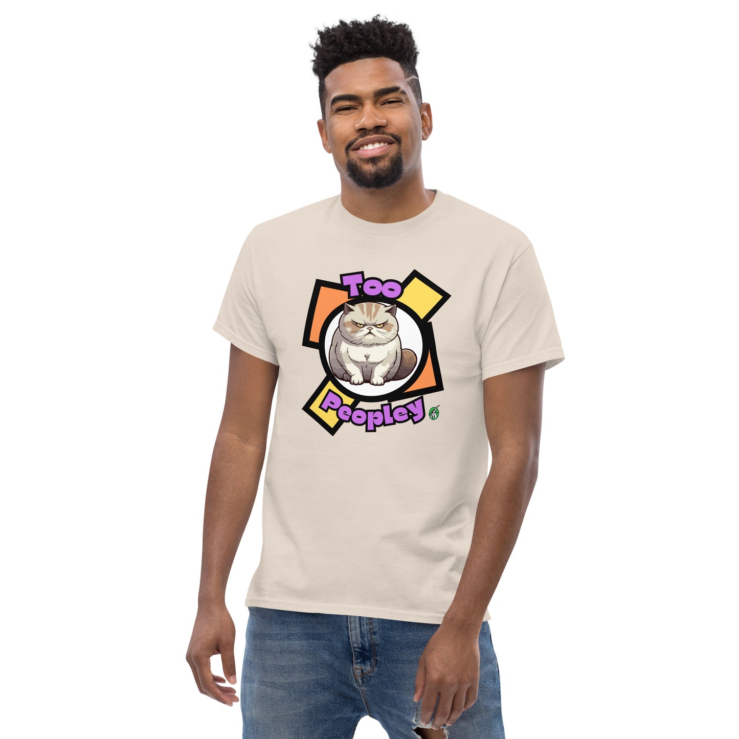 A man standing and wearing a beige t-shirt with a printed graphic of a grumpy cat with the words, 'Too Peopley'. Designed by Wizard Prints.