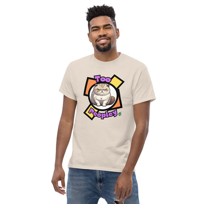 A man standing and wearing a beige t-shirt with a printed graphic of a grumpy cat with the words, 'Too Peopley'. Designed by Wizard Prints.