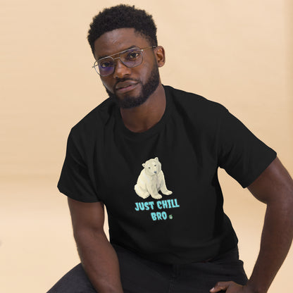 A man sitting and wearing a black t-shirt with a printed graphic of a bear with the words, 'Just Chill Bro'. Designed by Wizard Prints.