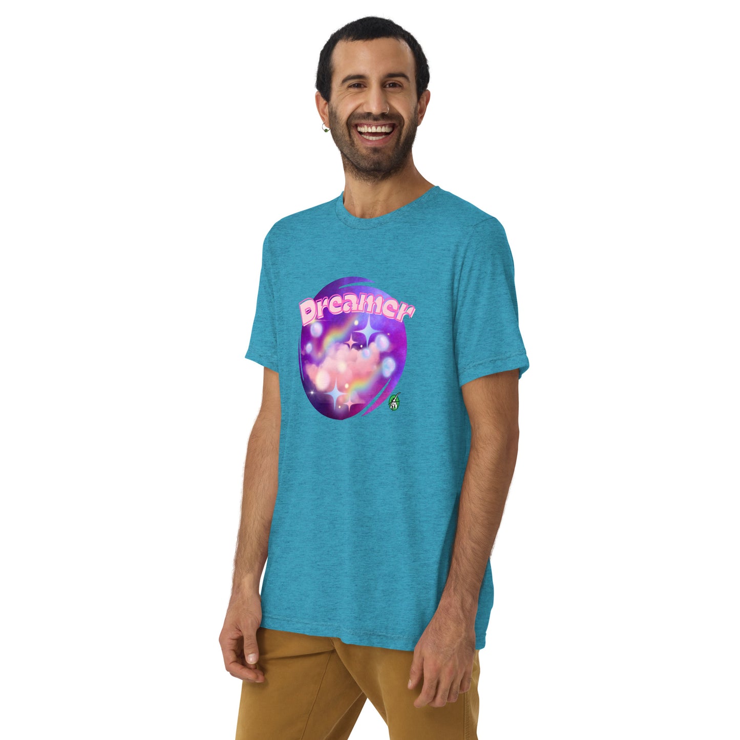 A man standing wearing an aqua blue tee shirt with a printed graphic of a galaxy background and the word Dreamer on top. Designed by Wizard Prints