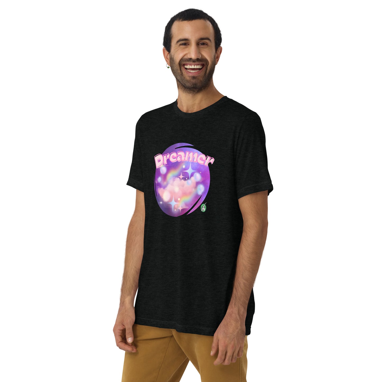 A man standing wearing a black tee shirt with a printed graphic of a galaxy background and the word Dreamer on top. Designed by Wizard Prints