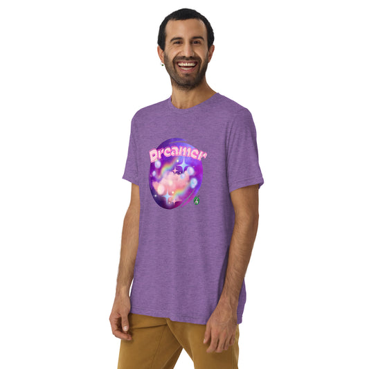 A man standing wearing a purple tee shirt with a printed graphic of a galaxy background and the word Dreamer on top. Designed by Wizard Prints