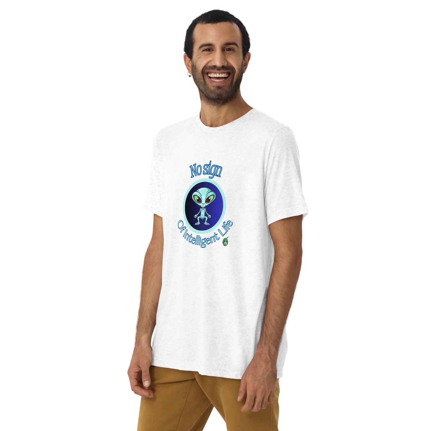 A man standing wearing a white tee shirt with a printed graphic of a blue alien and the words No Sign of Intelligent Life. Designed by Wizard Prints