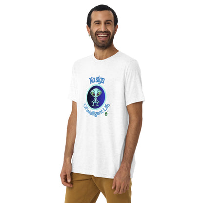 A man standing wearing a white tee shirt with a printed graphic of a blue alien and the words No Sign of Intelligent Life. Designed by Wizard Prints