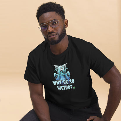 A man sitting and wearing a black t-shirt with a printed graphic of a blue ghost girl with the words, 'Why Be So Weird?'. Designed by Wizard Prints.