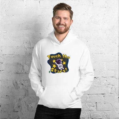 A man standing wearing a white hoodie with a printed graphic of a cartoon astronaut and the words, Touch the Stars. Designed by Wizard Prints.