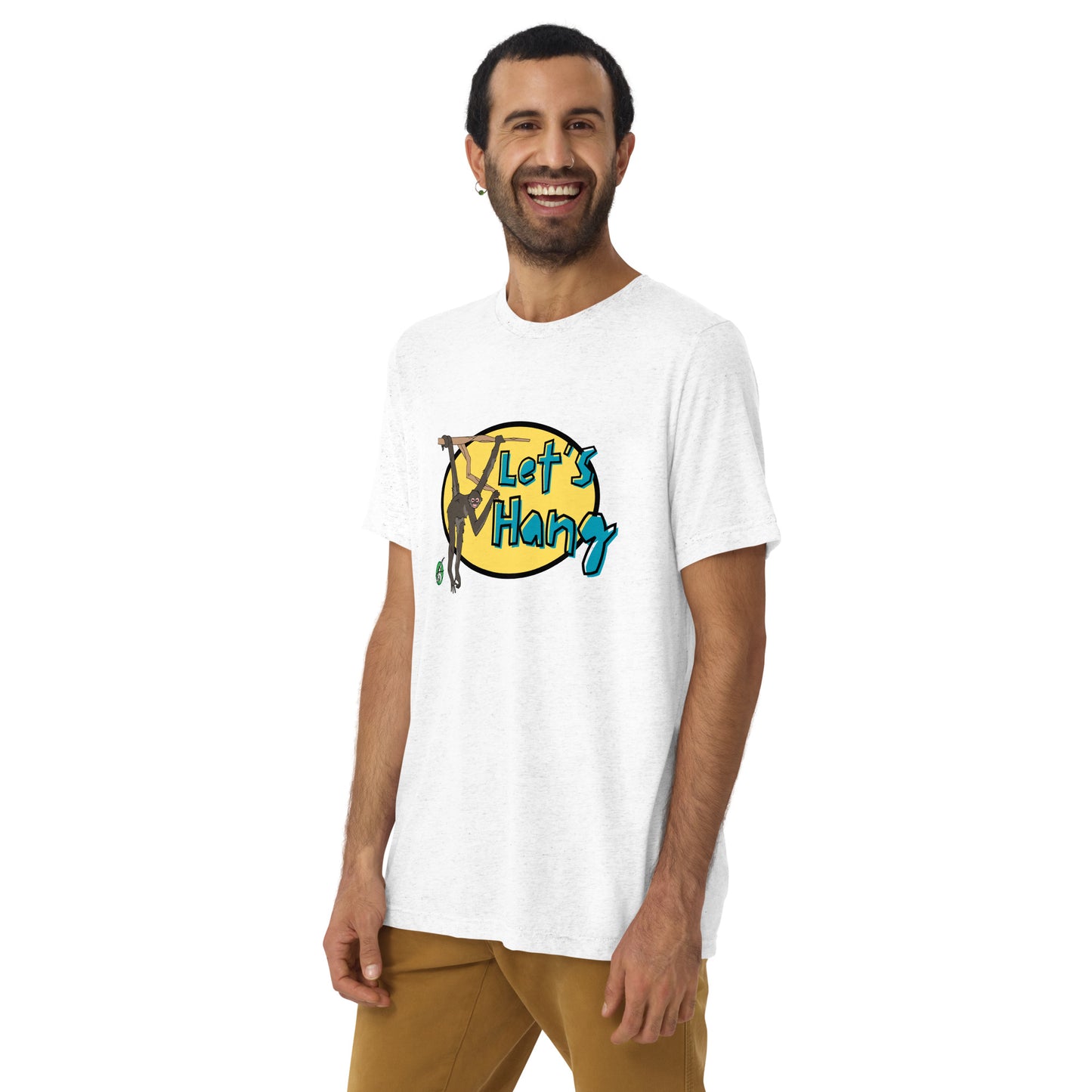 A man standing wearing a white tee shirt with a printed graphic of a monkey hanging on a branch with the words, Let's Hang. Designed by Wizard Prints