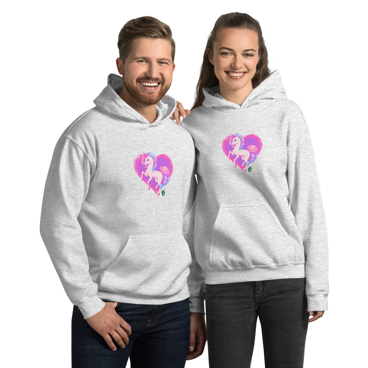 A man and a woman standing wearing an ash hoodie featuring a graphic of a pink unicorn on a purple heart background, designed by Wizard Prints.
