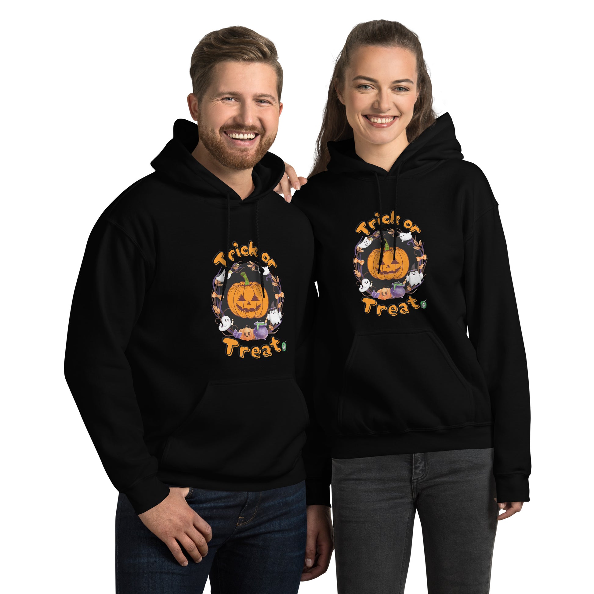 A man and woman standing wearing a Wizard Prints Halloween hoodie in black with a printed graphic on the front of a pumpkin saying Trick or Treat!