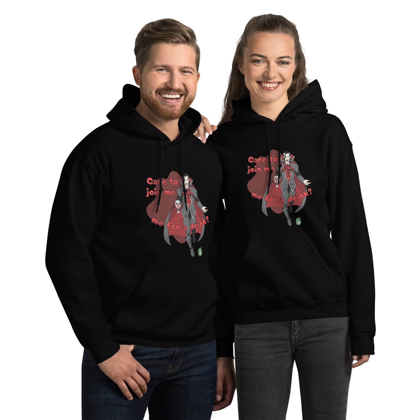 A man and woman standing wearing a Wizard Prints Halloween hoodie in black with a printed graphic on the front of a vampire saying Care to Join me for a Drink?!
