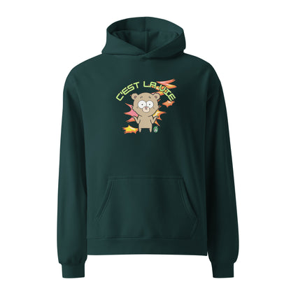 A unisex pine green hoodie by Wizard Prints featuring a printed graphic of a shrugging cartoon bear and the words, C'est La Vie.