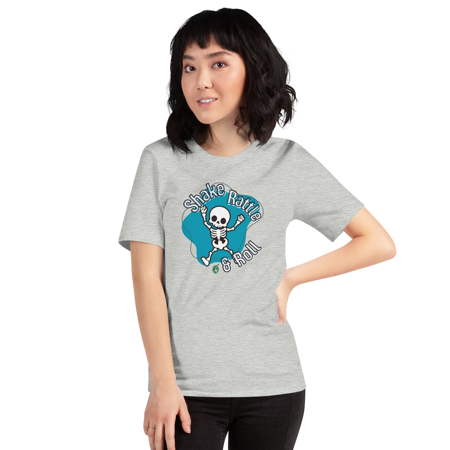 A woman standing wearing a Wizard Prints Halloween tee shirt in grey with a printed graphic on the front of a skeleton dancing saying shake rattle and roll!