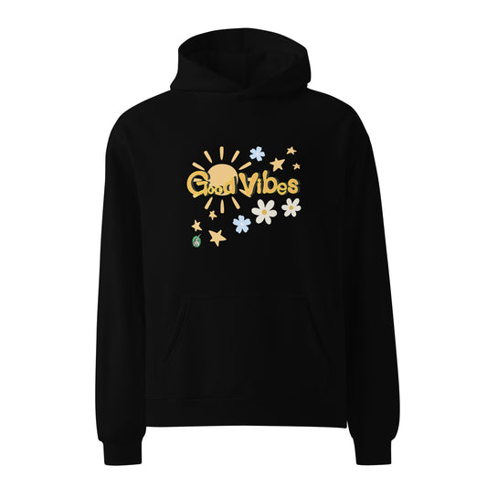 A unisex black hoodie by Wizard Prints featuring a printed graphic of the sun, flowers, stars and the words, 'Good Vibes'.