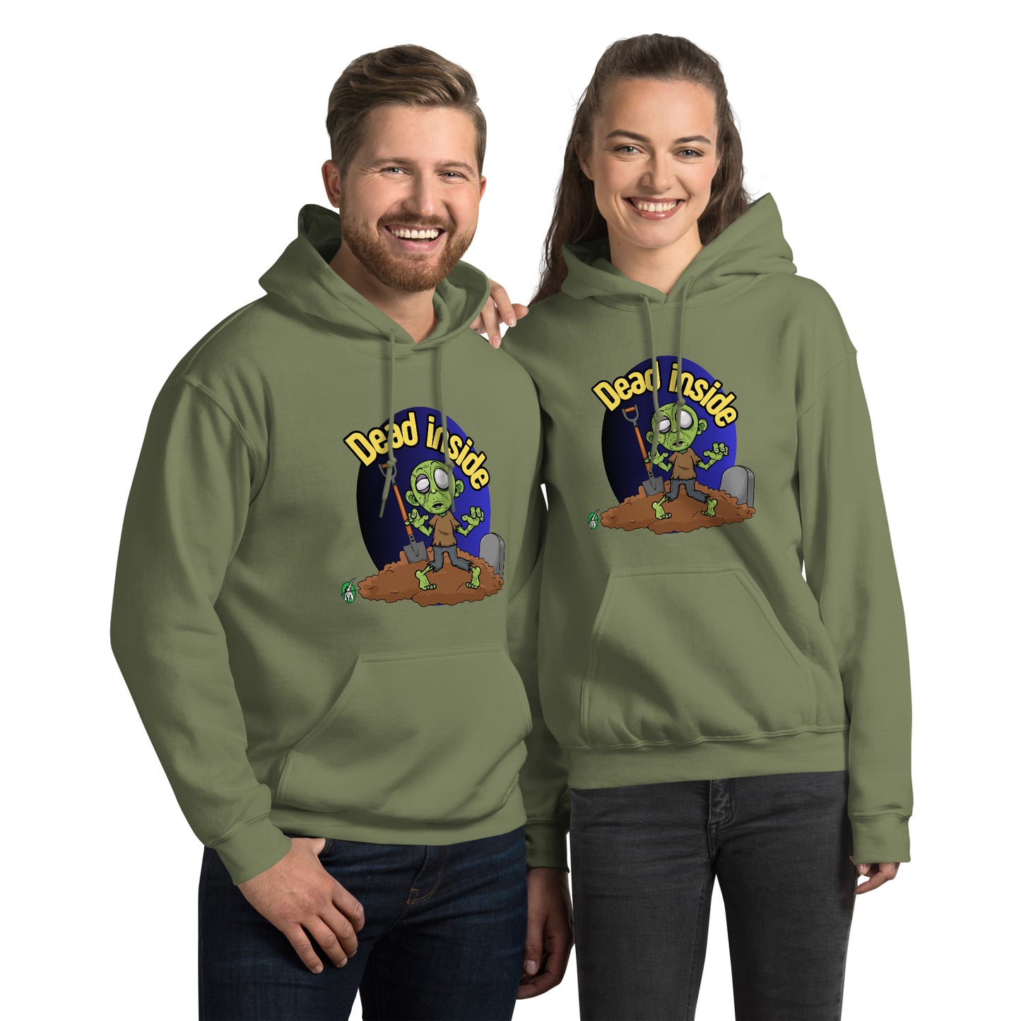 A man and woman standing wearing a Wizard Prints Halloween hoodie in military green with a printed graphic on the front of a zombie at a gravesite saying Dead Inside