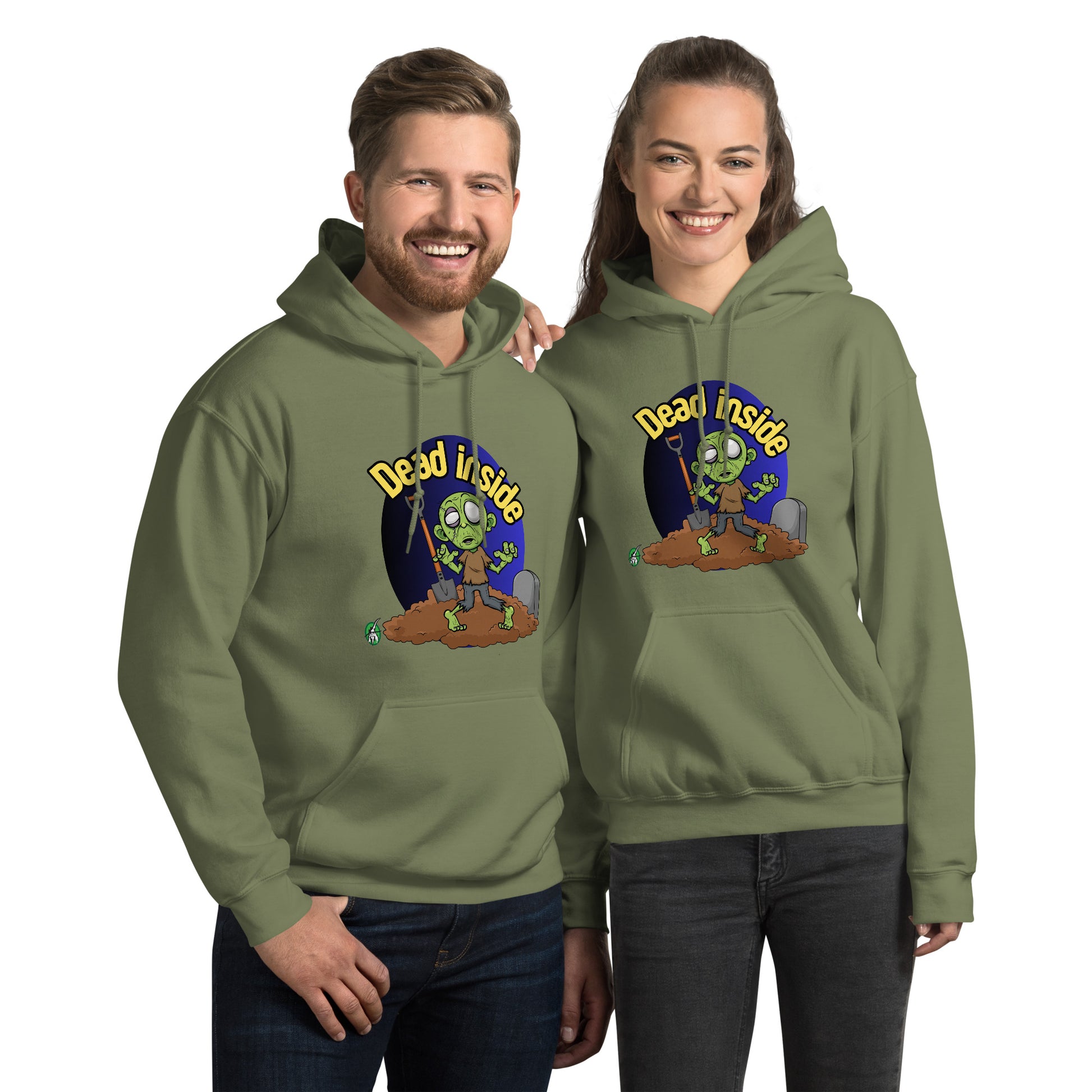 A man and woman standing wearing a Wizard Prints Halloween hoodie in military green with a printed graphic on the front of a zombie at a gravesite saying Dead Inside